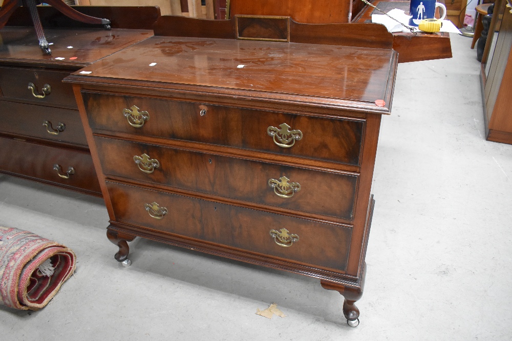 An Edwardian chest of three drawers having original handles and oak lining