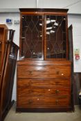 An Edwardian mahogany secretaire bookcase having astral glazed top with ebonised detailing , lower