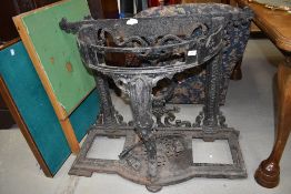 A C19th cast iron Coalbrookdale style frame hall stand, having cabriole front support and paw foot