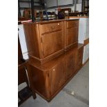 A selection of mid century bedroom furniture including double side cabinets and drawer base in a