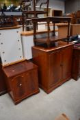 A modern reproduction media cabinet and smaller matching cupboard with vinyl records included