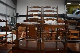 A pair of reproduction ladder back dining chairs