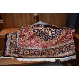 a large carpet square or rug having Turkish design with deep blue and burgundy ground