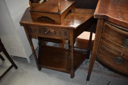 An Old Charm style hall way side table having turned supports