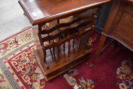 A Canterbury style magazine rack side table by Ancient Mariner