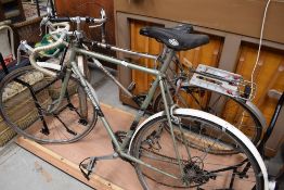 Two vintage road racing cycle bikes incluidng a Raleigh and Smalleys viscount