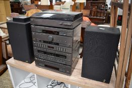 A stackable hi fi unit and record player by JVC with a pair of speakers