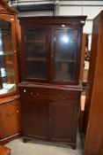 An early 20th shallow bookcase, with double cupboard under, width approx. 78cm