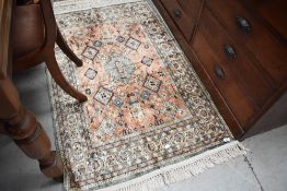 A Persian Shirvan style silk carpet rug, approx. 140 x 90cm