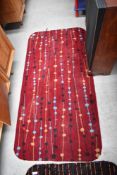 A vintage mid century carpet rug with an atomic design
