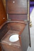 A 19th Century mahogany commode, of box form, some damage and old repair to arm rest