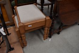 Two pine dressing table stools with upholstered drop in seats