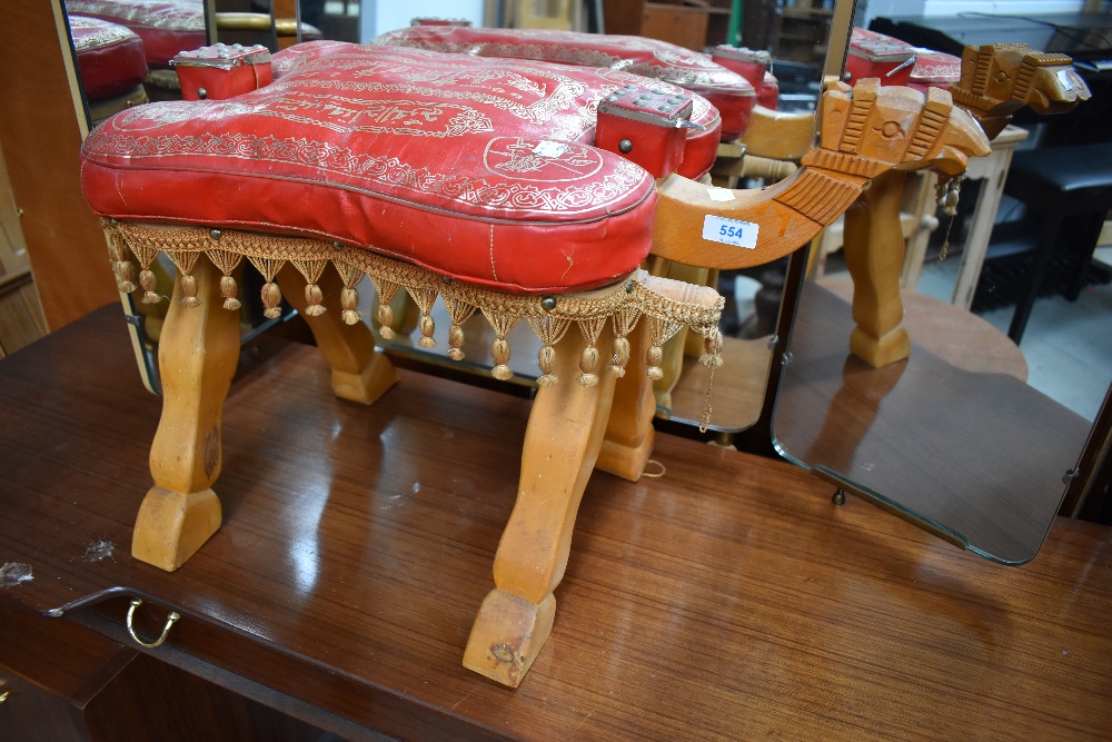 A beech wood camel stool in the form of a camel