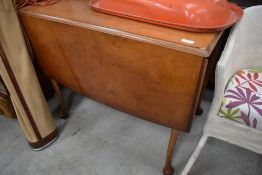 A mid 20th Century walnut and ply drop leaf table on cabriole legs