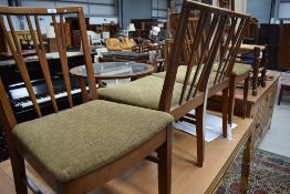 A set of four vintage fork back dining chairs