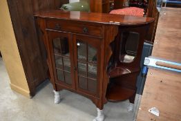 A late Victorian Dresser base having velvet and mirror back with glazed cupboard under