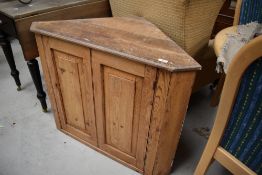 A stripped pine corner cabinet base, width approx. 92cm