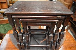 A mid to late 20th Century dark stained nest of occasional table`