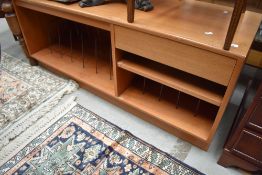 A vintage teak hifi sideboard having dividers for LP and singles, and cassette drawer