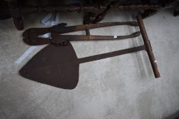A vintage hay or silage knife and bolt croppers