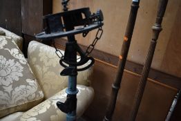 A vintage spotlight or searchlight stand