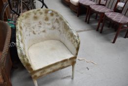 A vintage woven fibre tub chair