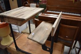 An early school desk having iron frame work with pine seat and desk