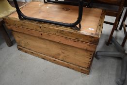 An antique pine chest having dovetail carcass with flat plank top