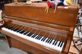 A six and a half octave up right piano in great condition by Bentley Resonoura serial 103463