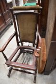 A Victorian mahogany American style rocking chair