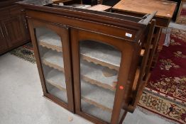 A upper glazed book case top in mahogany with lockable front