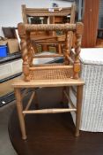 A Victorian stained frame bedroom chair with canework seat and a traditional strung stool