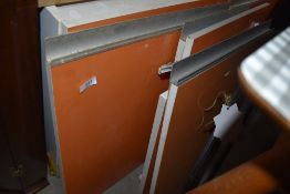 A selection of vintage kitchen cabinet doors in orange