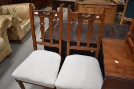 AS pair of late Victorian oak dining chairs , Arts and Crafts/Art Nouveau transitional design