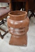 A vintage Louvre style salt glazed chimney pot