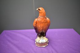 A Beswick Beneagles Whisky Flask modelled as a Golden Eagle containing 70% proof and 26 2/3 fl oz of