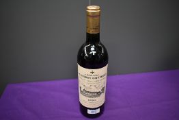 A bottle of 1990 Chateau La Mission Haut Brion Cru Classe De Graves, Domaine Clarence Dillon S.A,
