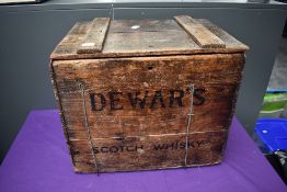 A mid 20th century Pine Storage Box for Dewars Scotch Whisky having hinged lid