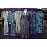 A collection of vintage and retro Ladies clothing in a mixture of colours,styles and eras