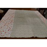 A large vintage quilt having floral section used throughout and backed in white cotton.