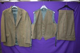 A three piece tweed suit by Bob Parratt, larger size.