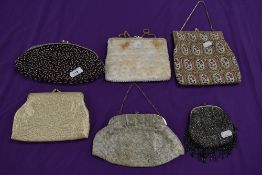 A collection of vintage evening bags beaded and embroidered examples amongst this lot