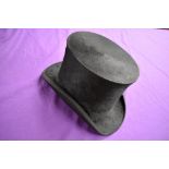 An antique top hat 'R.W.T.K Thompson Kendal' internal measurement approx 21' height approx 6',some