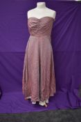 A 1950s strapless evening gown having iridescent blue and pink finish.