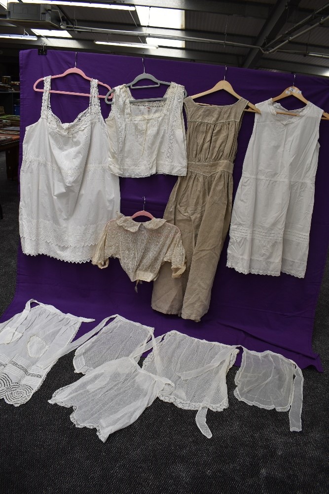 A collection of antique Victorian and Edwardian white wear including bodice,petticoats,camisole,