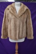 A short vintage blonde mink coat.