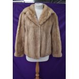 A short vintage blonde mink coat.