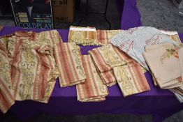 A good quantity of vintage curtains, fabric and cushion covers, around late 50s to 60s.