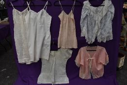 A selection of vintage and antique ladies lingerie and nightwear including camisole,lace edged bed