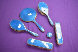 A blue guilloche art deco dressing table set.